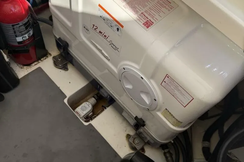  Yacht Photos Pics Engine compartment of 2022 Scout 425 LXF with generator and fire extinguisher.