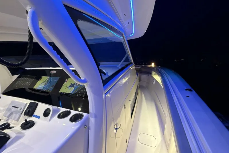  Yacht Photos Pics 2022 Scout 425 LXF boat interior with illuminated dashboard and sleek design.