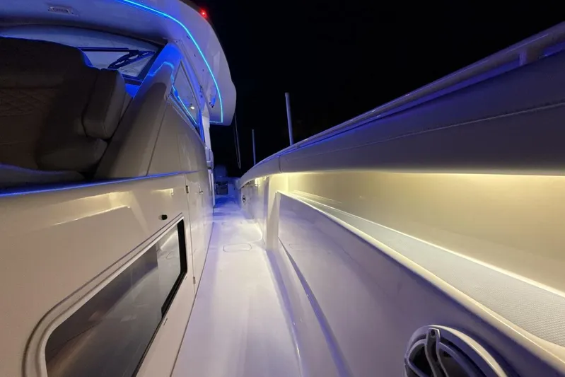  Yacht Photos Pics 2022 Scout 425 LXF boat interior with ambient blue lighting at night.