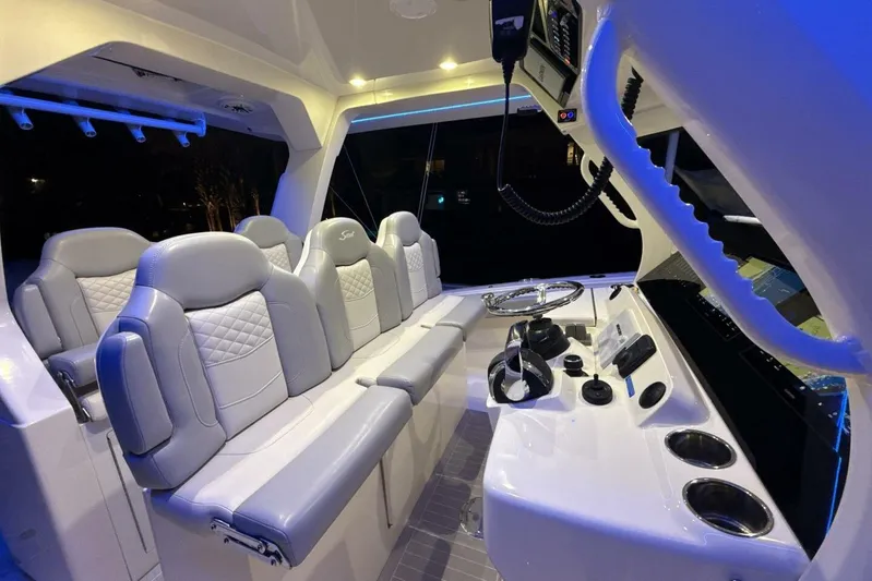  Yacht Photos Pics Luxurious interior of 2022 Scout 425 LXF boat with plush seating and modern controls.