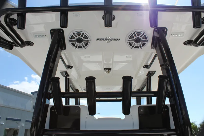  Yacht Photos Pics 2024 Fountain 32 NX boat with rod holders and speakers, viewed from below.