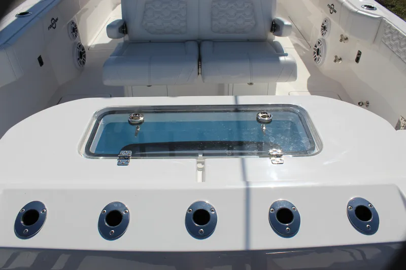  Yacht Photos Pics 2024 Fountain 32 NX boat interior with seating and livewell.