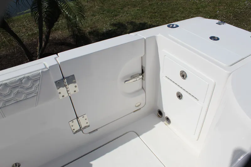  Yacht Photos Pics 2024 Fountain 32 NX boat interior, featuring white storage compartments and sleek design elements.