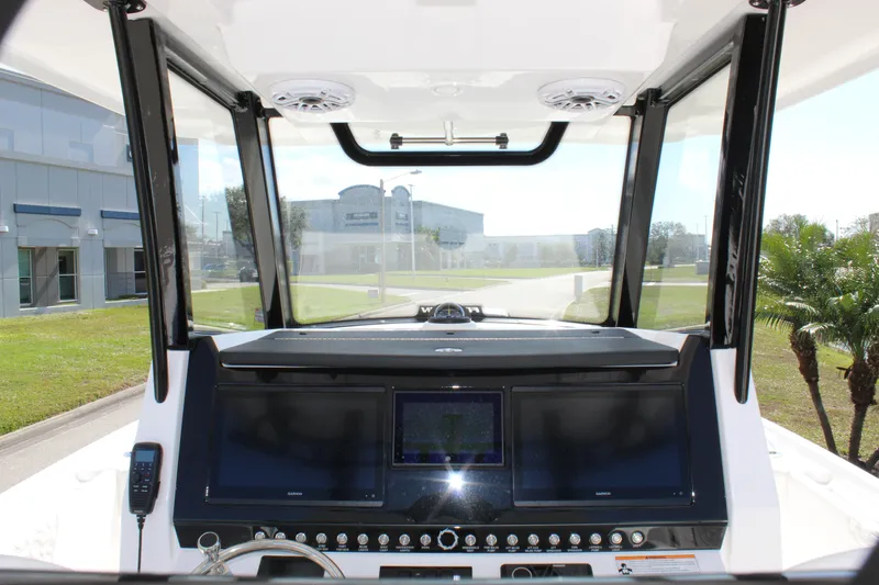  Yacht Photos Pics 2024 Fountain 32 NX boat dashboard with modern navigation screens and controls.