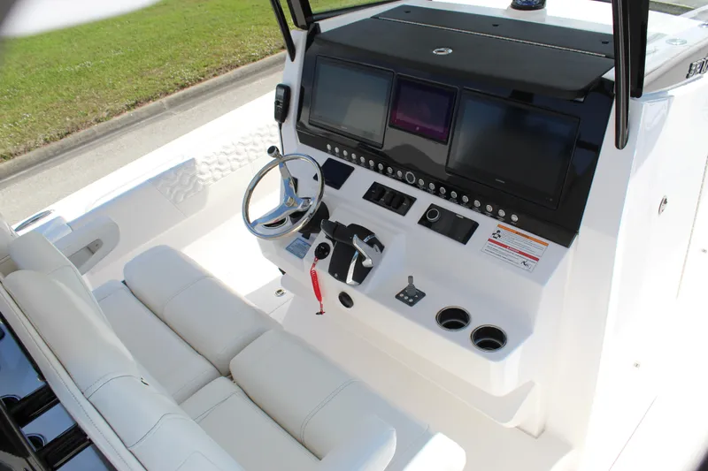  Yacht Photos Pics 2024 Fountain 32 NX boat cockpit with modern controls and comfortable seating.