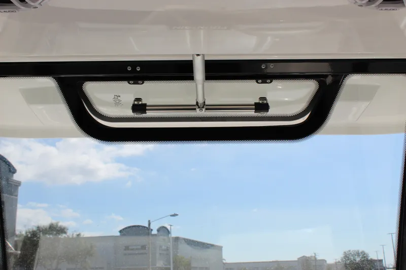  Yacht Photos Pics 2024 Fountain 32 NX boat window view with clear sky background.