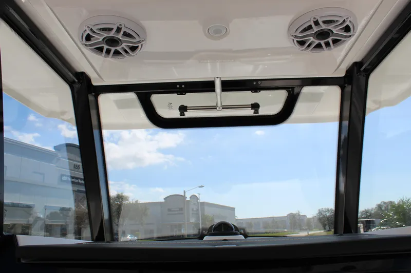  Yacht Photos Pics 2024 Fountain 32 NX boat interior view with speakers and clear sky.