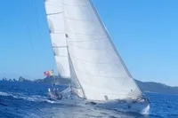 Sailboat Cape Codder Coder Withbread 57, 1985, navigating blue ocean waters.