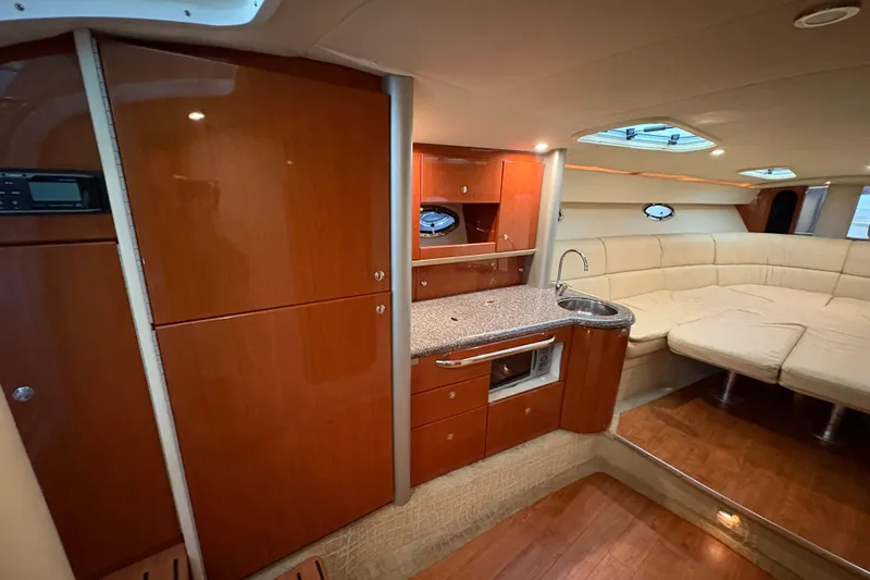  Yacht Photos Pics Luxurious interior of 2008 Formula 400 Super Sport yacht with kitchenette and seating area.