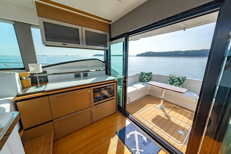 Bacchus Yacht Photos Pics Luxurious interior of 2022 Tiara Yachts Coupe with scenic ocean view.