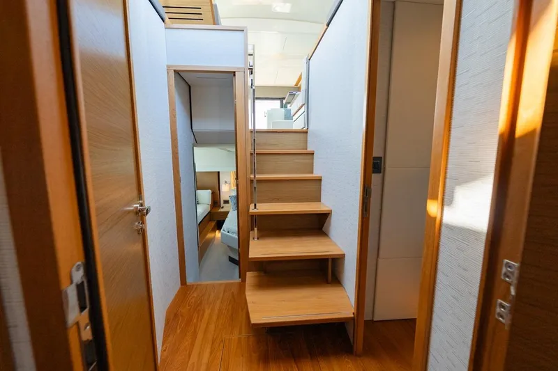 Bacchus Yacht Photos Pics 2022 Tiara Yachts Coupe interior with wooden stairs and modern design.
