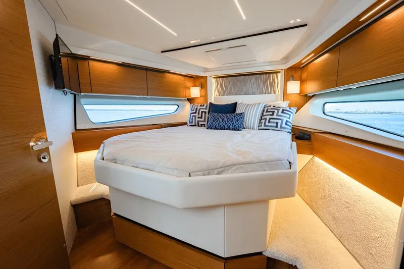 Bacchus Yacht Photos Pics Luxurious 2022 Tiara Yachts Coupe bedroom interior with modern design and elegant furnishings.
