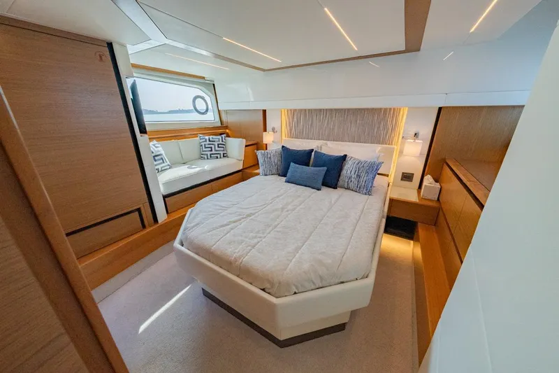 Bacchus Yacht Photos Pics Luxurious 2022 Tiara Yachts Coupe bedroom with modern design and elegant furnishings.