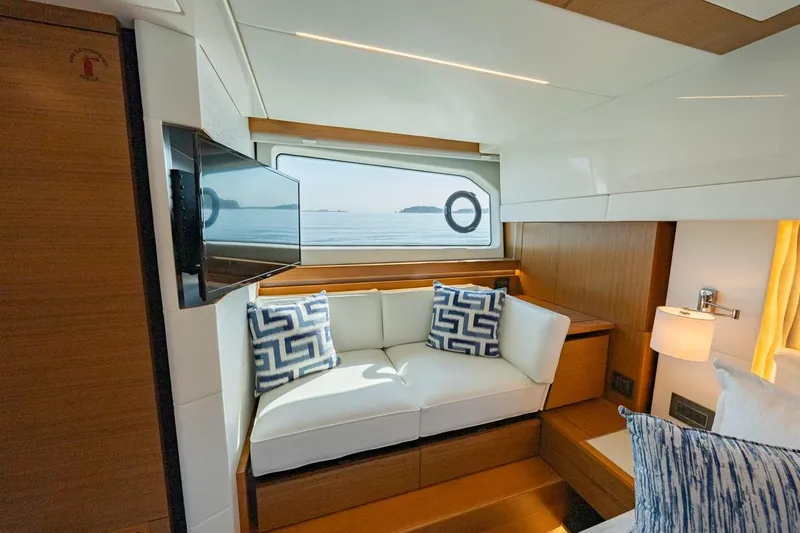Bacchus Yacht Photos Pics Luxurious interior of 2022 Tiara Yachts Coupe with elegant seating and ocean view.