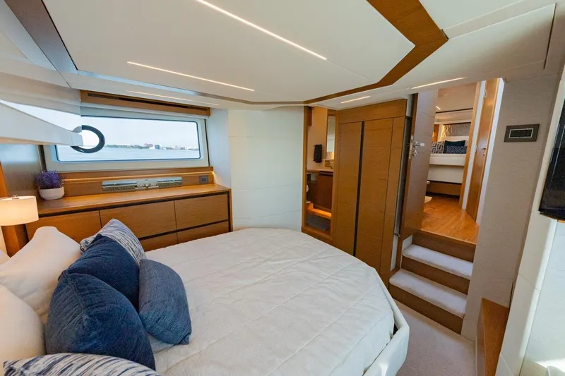 Bacchus Yacht Photos Pics Luxurious 2022 Tiara Yachts Coupe bedroom interior with modern design and elegant furnishings.