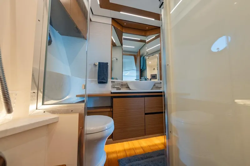 Bacchus Yacht Photos Pics Luxurious bathroom interior of 2022 Tiara Yachts Coupe, featuring modern fixtures and elegant design.