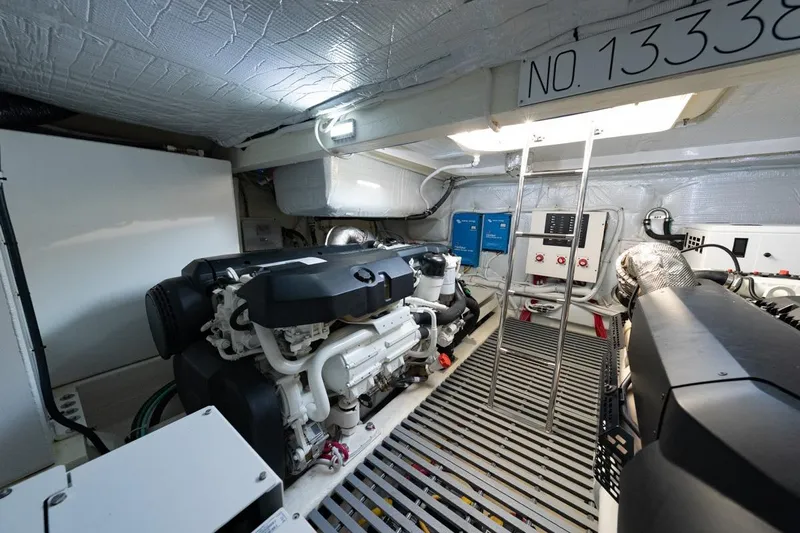 Bacchus Yacht Photos Pics Engine room of 2022 Tiara Yachts Coupe, featuring modern equipment and control panels.