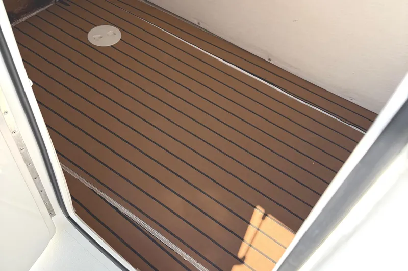 Huntress Yacht Photos Pics Teak deck flooring on 2007 SeaHunter 40 boat, featuring sleek design and durable materials.