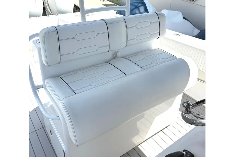 Huntress Yacht Photos Pics White cushioned seating on 2007 SeaHunter 40 boat, featuring sleek design and stitching.