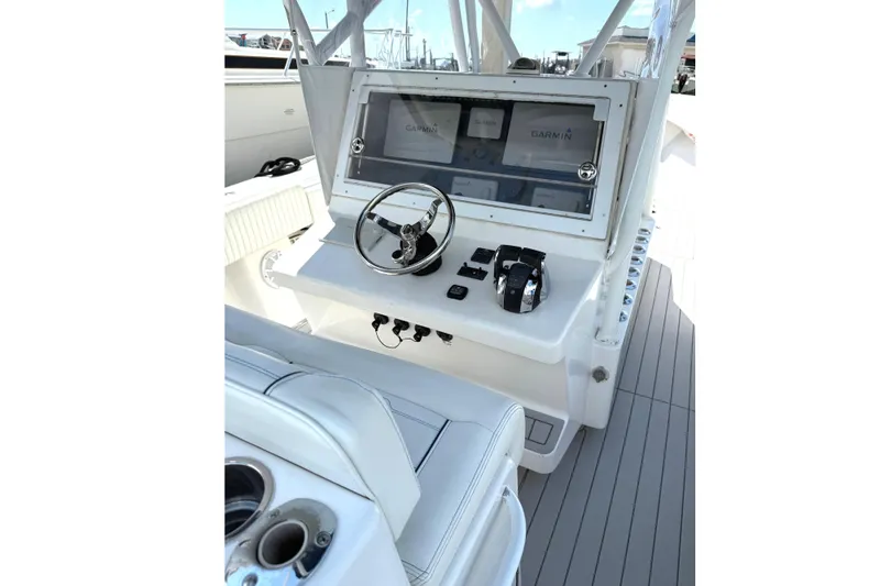 Huntress Yacht Photos Pics 2007 SeaHunter 40 boat helm with Garmin navigation system and steering wheel.