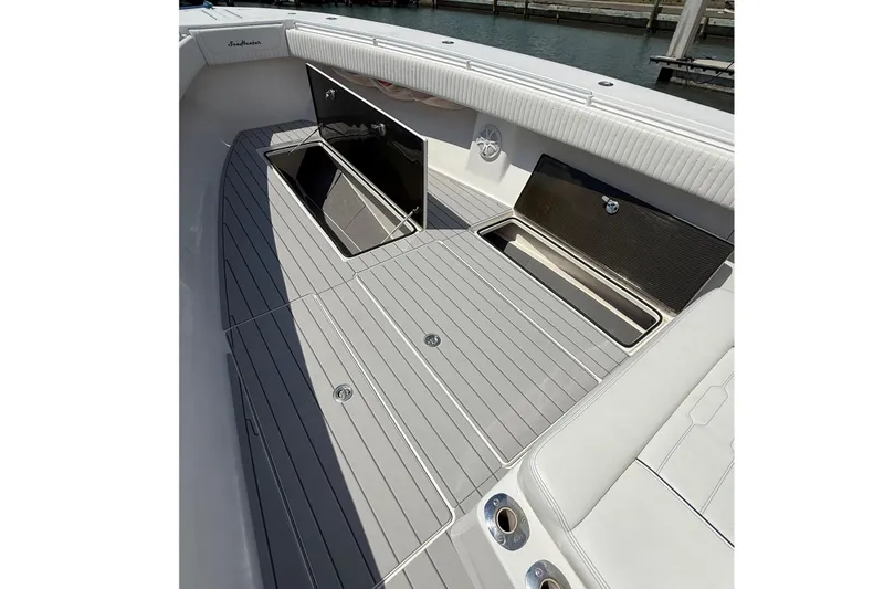 Huntress Yacht Photos Pics 2007 SeaHunter 40 boat deck with open storage compartments, featuring sleek design and modern finishes.