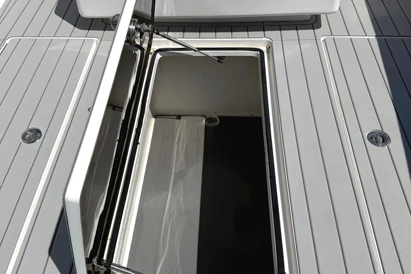 Huntress Yacht Photos Pics Open storage compartment on 2007 SeaHunter 40 boat deck, showcasing interior space.