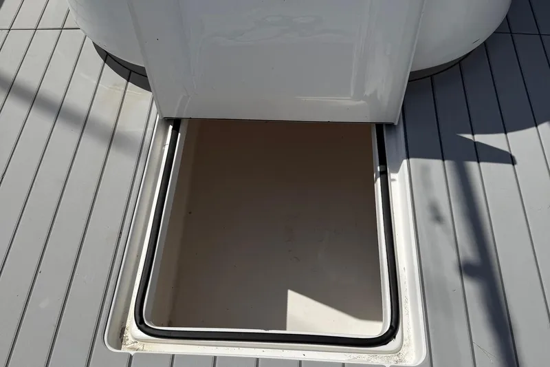 Huntress Yacht Photos Pics Open hatch on 2007 SeaHunter 40 boat deck, showing interior compartment.