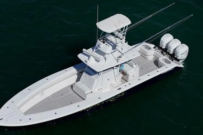 Huntress Yacht Photos Pics 2007 SeaHunter 40 boat with triple outboard engines on open water.