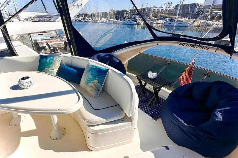 My Way Yacht Photos Pics Luxurious 2001 Fairline 55 yacht interior with elegant seating and marina view.