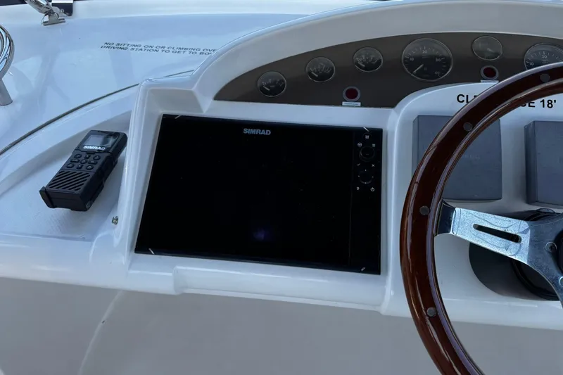 My Way Yacht Photos Pics Control panel of a 2001 Fairline 55 yacht with Simrad display and steering wheel.