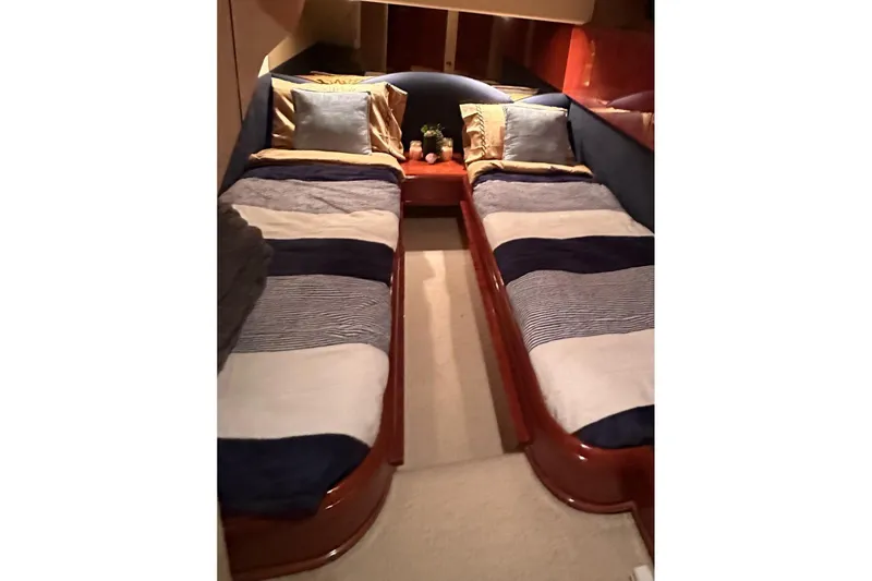 My Way Yacht Photos Pics Interior cabin of 2001 Fairline 55 yacht with twin beds and cozy decor.