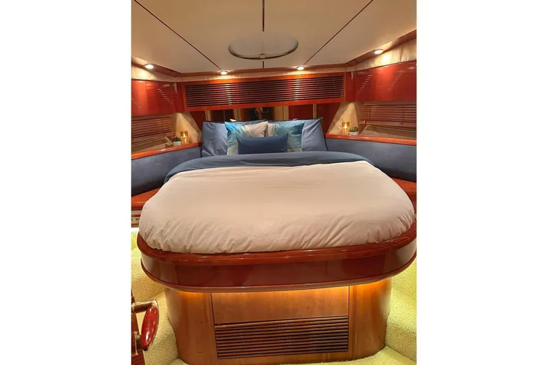 My Way Yacht Photos Pics Luxurious cabin interior of a 2001 Fairline 55 yacht with elegant bedding and wood finishes.