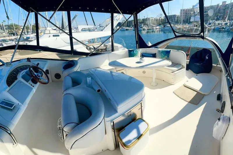 My Way Yacht Photos Pics Luxurious 2001 Fairline 55 yacht interior with elegant seating and marina view.