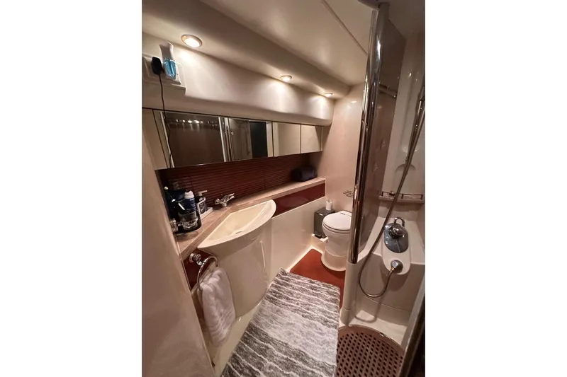 My Way Yacht Photos Pics Luxurious bathroom in 2001 Fairline 55 yacht with modern fixtures and elegant design.