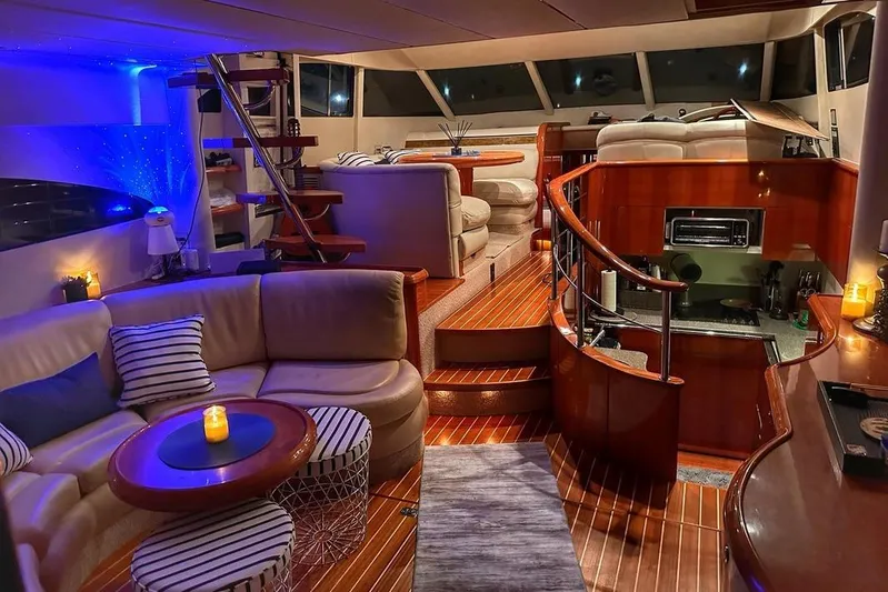 My Way Yacht Photos Pics Luxurious interior of 2001 Fairline 55 yacht with elegant seating and ambient lighting.