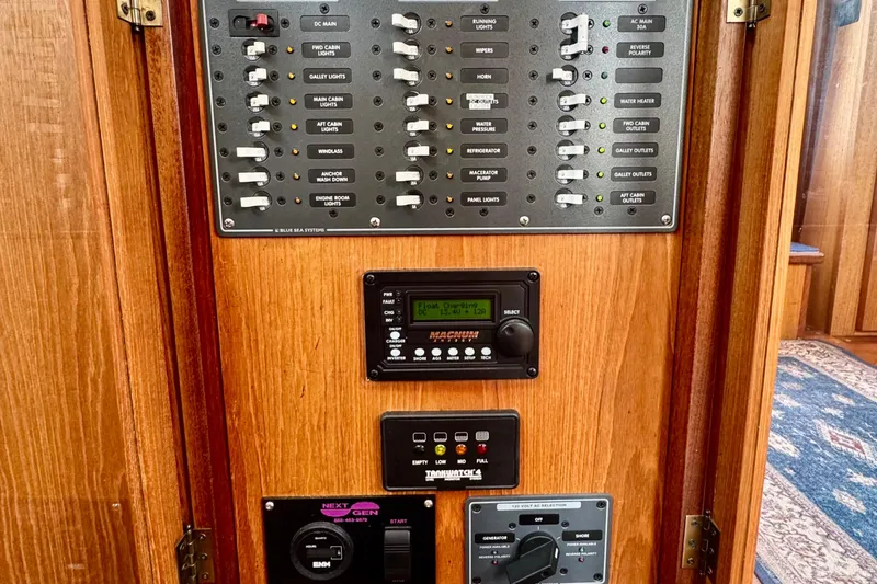 Rosie Mclane Yacht Photos Pics Control panel on a 2006 Westcoast Sedan, featuring switches and electronic displays.