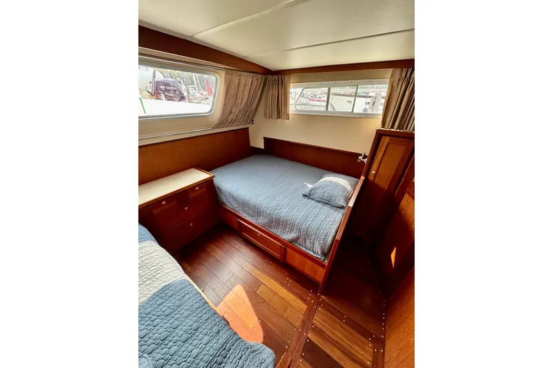 Rosie Mclane Yacht Photos Pics Cozy cabin interior with wooden furnishings and a comfortable bed, Westcoast Sedan 2006.