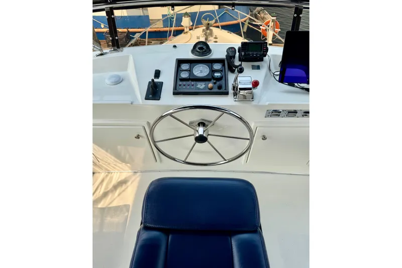 Rosie Mclane Yacht Photos Pics Helm of a 2006 Westcoast Sedan boat with navigation controls and steering wheel.