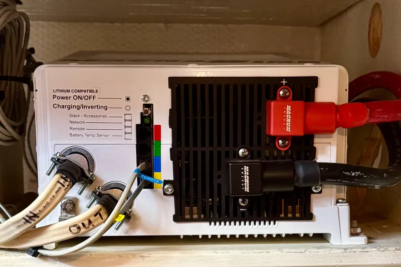 Rosie Mclane Yacht Photos Pics Power inverter with lithium compatibility, showing cables and connections in a 2006 Westcoast Sedan.