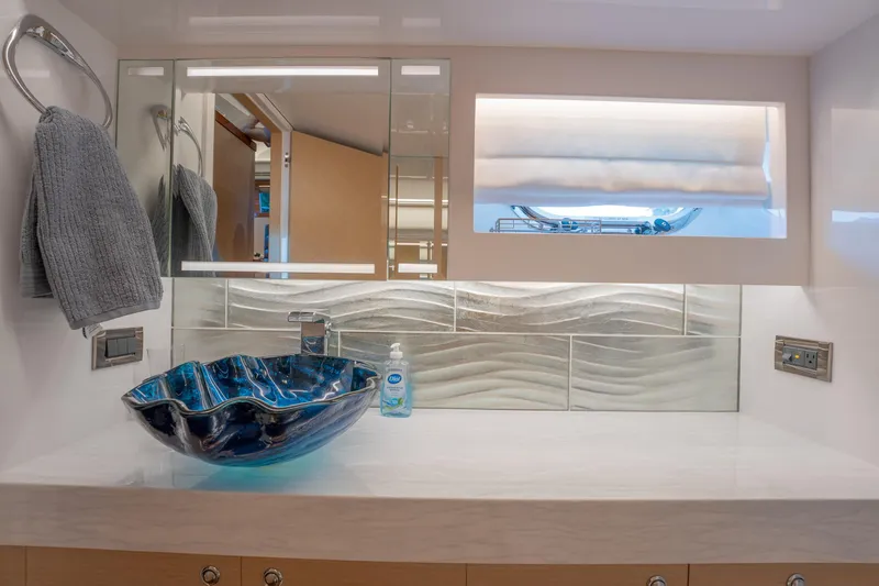 Passion Yacht Photos Pics Luxurious bathroom with blue glass sink in 2019 Horizon PC52 yacht.