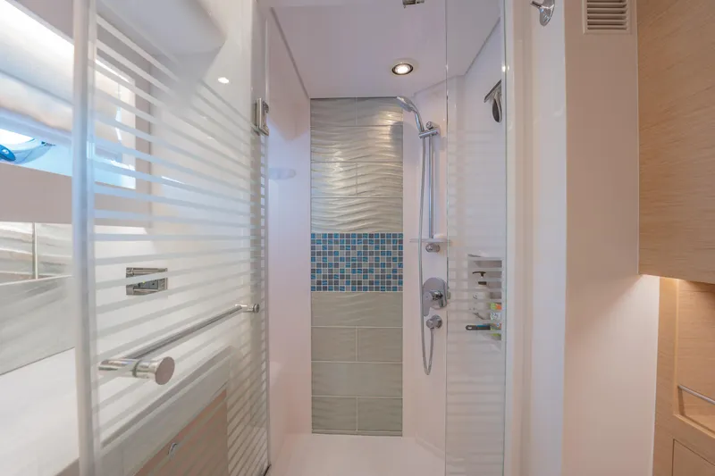 Passion Yacht Photos Pics Modern shower area in 2019 Horizon PC52 yacht with sleek design and glass door.