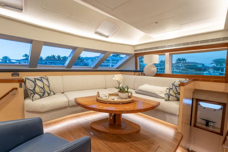 Passion Yacht Photos Pics Luxurious 2019 Horizon PC52 yacht interior with elegant seating and panoramic windows.