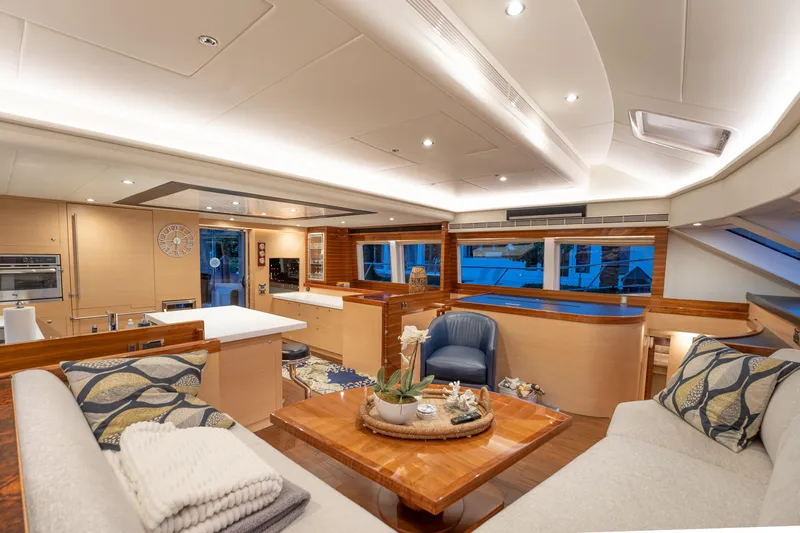 Passion Yacht Photos Pics Luxurious interior of 2019 Horizon PC52 yacht with modern furnishings and ambient lighting.