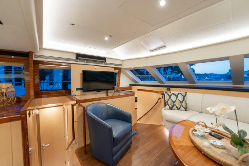 Passion Yacht Photos Pics Luxurious interior of 2019 Horizon PC52 yacht with modern furnishings and large windows.