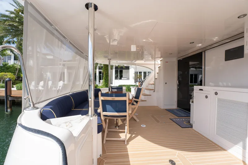 Passion Yacht Photos Pics Luxurious 2019 Horizon PC52 yacht deck with seating, table, and modern amenities.
