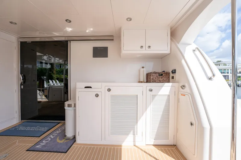 Passion Yacht Photos Pics Luxurious Horizon PC52 yacht interior, featuring sleek cabinetry and modern design, 2019 model.
