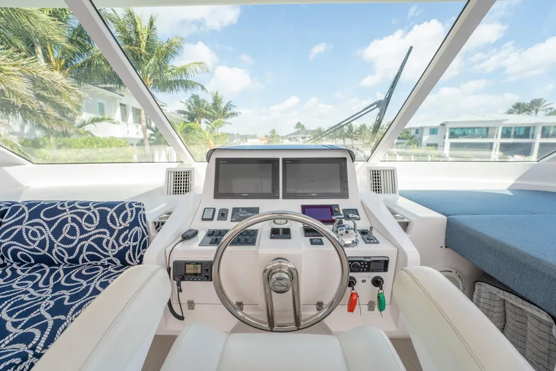 Passion Yacht Photos Pics Helm of 2019 Horizon PC52 yacht with modern controls and panoramic view.