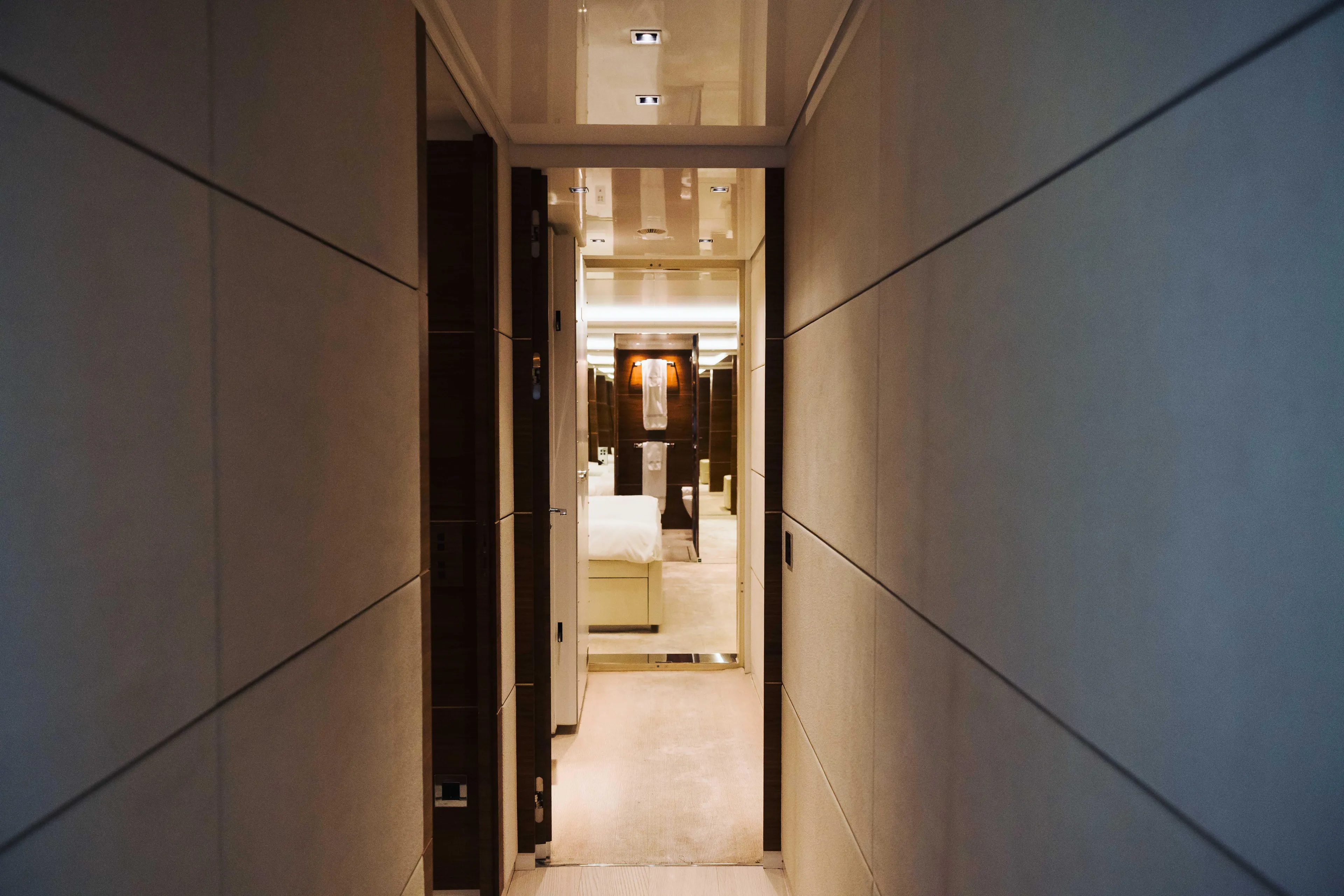  Yacht Photos Pics Luxurious hallway interior of 2018 Sanlorenzo 40Alloy yacht, featuring modern design and elegant lighting.