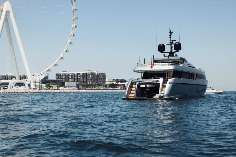  Yacht Photos Pics Luxury Sanlorenzo 40Alloy yacht, 2018 model, cruising near a coastal city with a Ferris wheel.