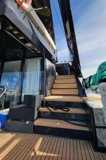  Yacht Photos Pics Luxury yacht Hussar WAVE 50, 2022 model, with wooden deck and stairs.